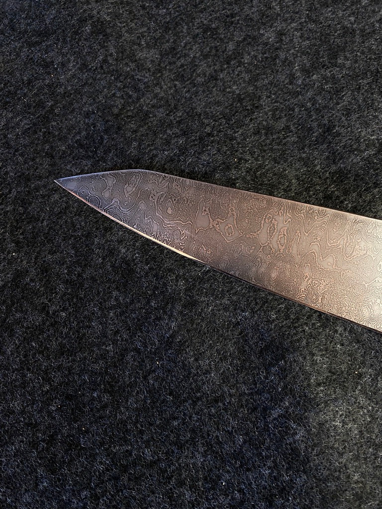 thumbs up damascus chefs knife