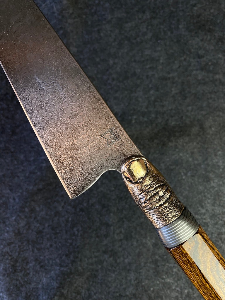 thumbs up damascus chefs knife
