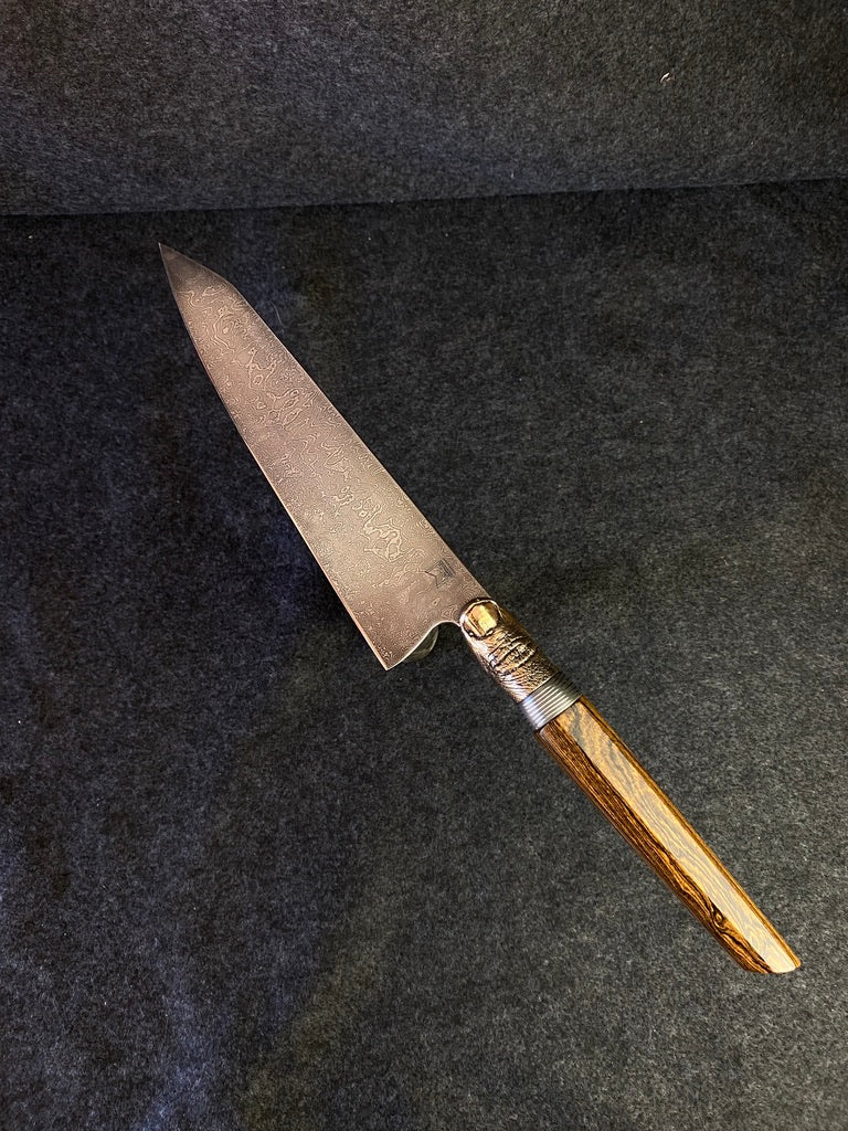 thumbs up damascus chefs knife